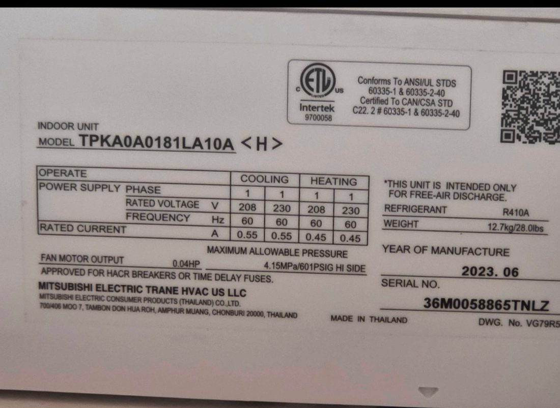 Photo of a Mitsubishi Electric Trane mini-split data plate showing model TPKA0A0181LA10A, serial 36M0058865TNLZ, 208/230V, refrigerant R410A and 0.04HP fan motor output